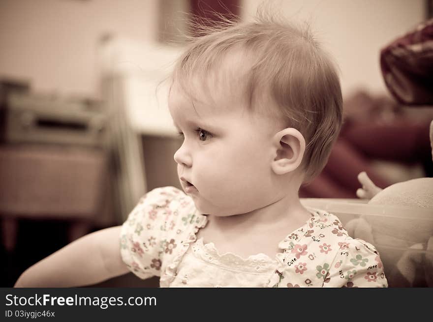 Little baby girl playing in  room