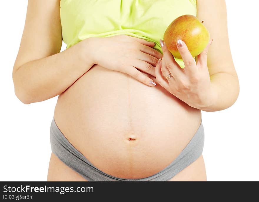 The pregnant married woman holds the apple