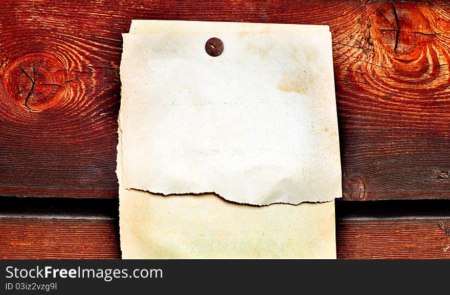 Blank paper hanging on the wooden background. Blank paper hanging on the wooden background