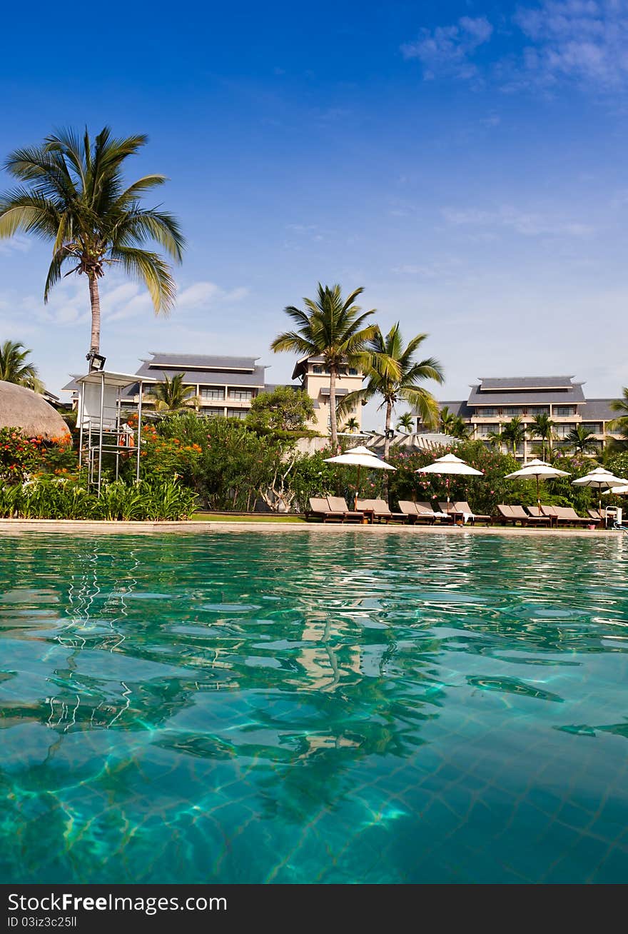 Beautiful swimming pool at hotel garden, Sanya, Hainan Island, China. Beautiful swimming pool at hotel garden, Sanya, Hainan Island, China.