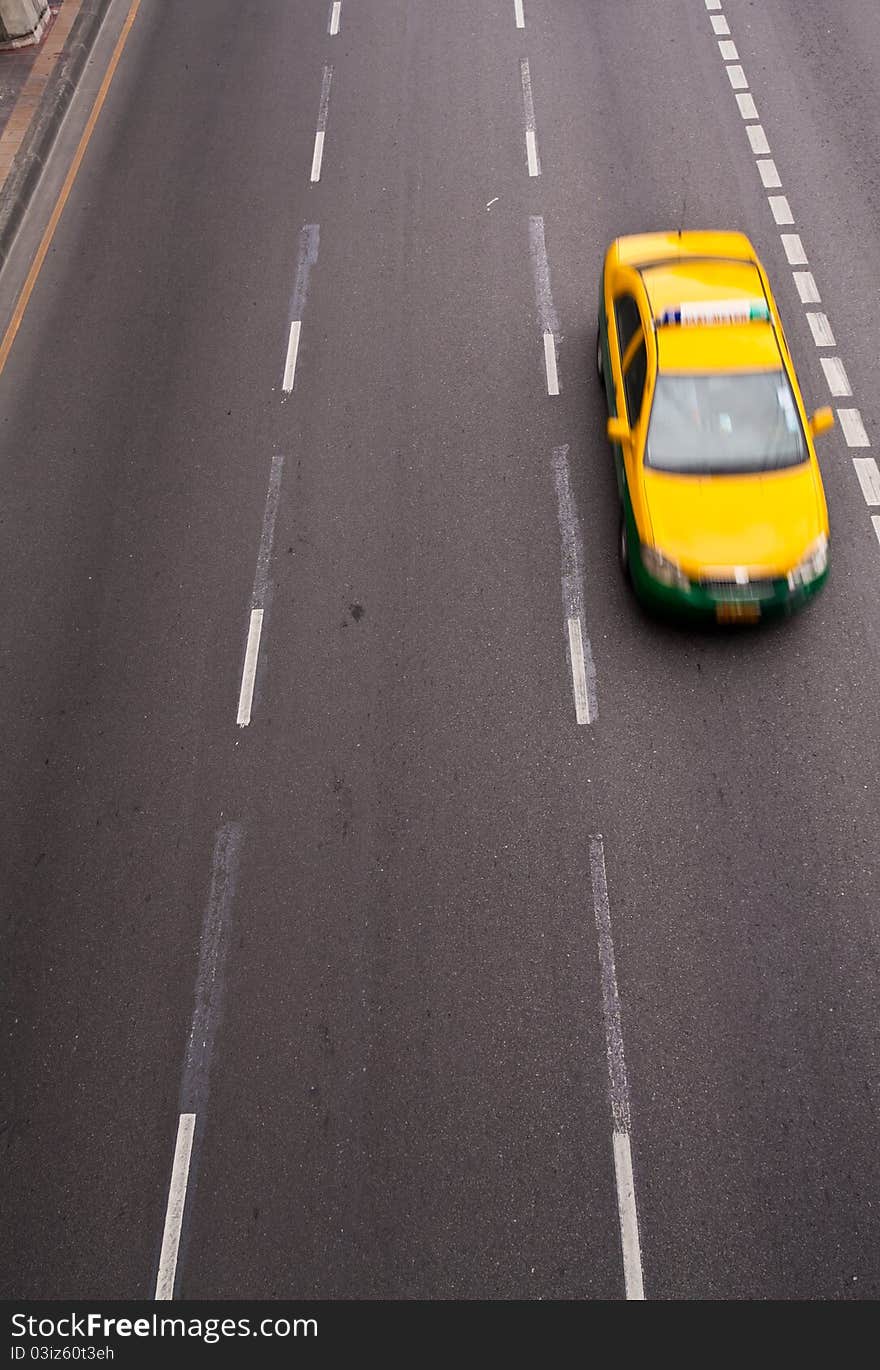 Yellow Car Running On The Road