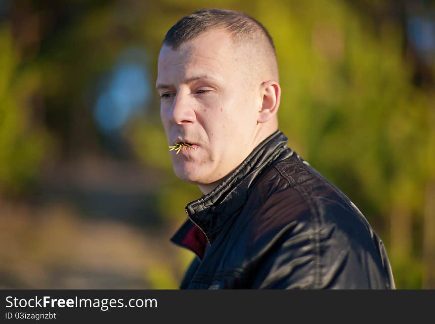 Portrait of young man eating salad, outdoors. Portrait of young man eating salad, outdoors