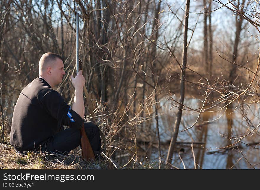 Male hunter aiming the hunt during a hunting party