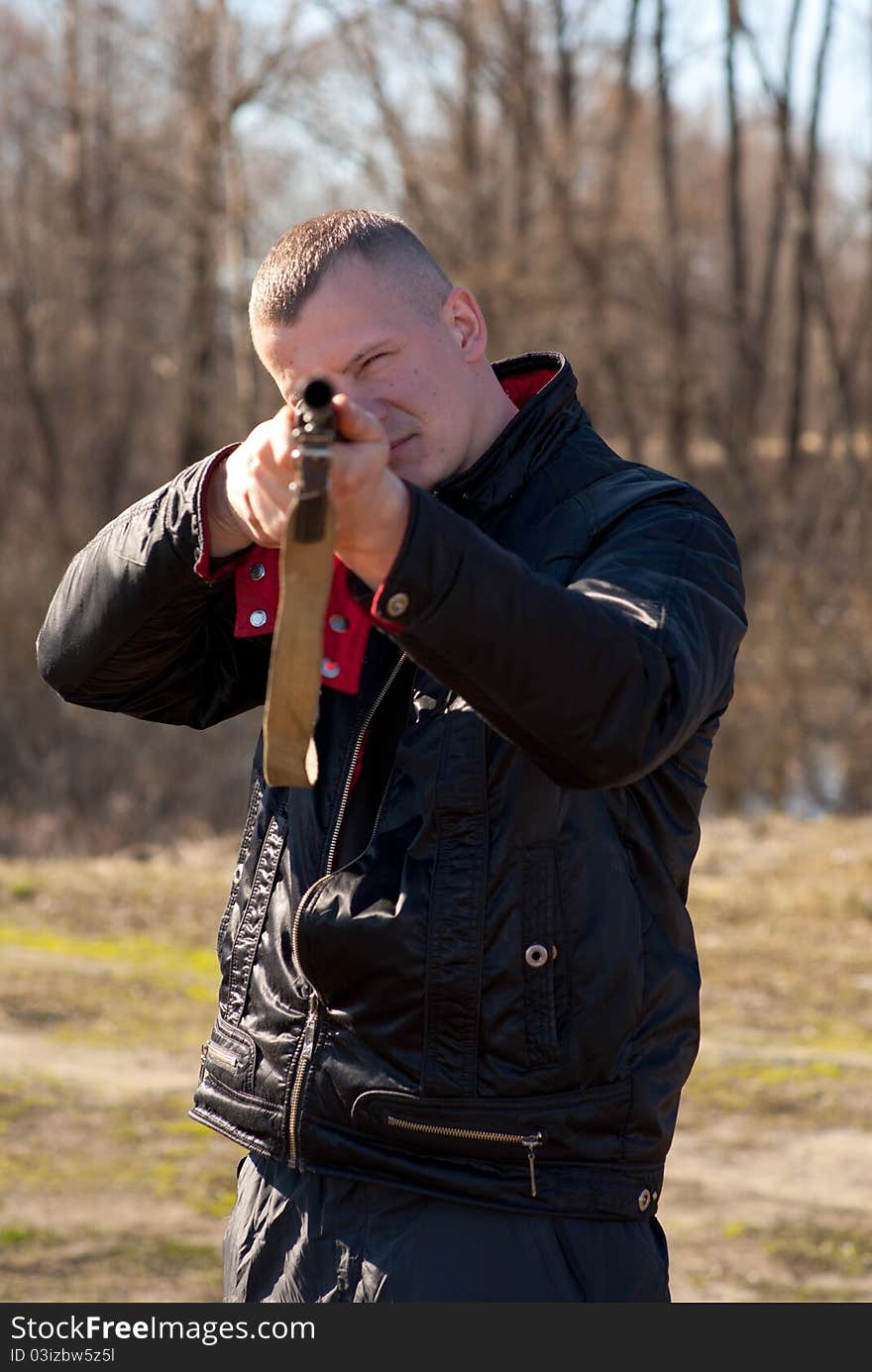 Male hunter aiming the hunt during a hunting party