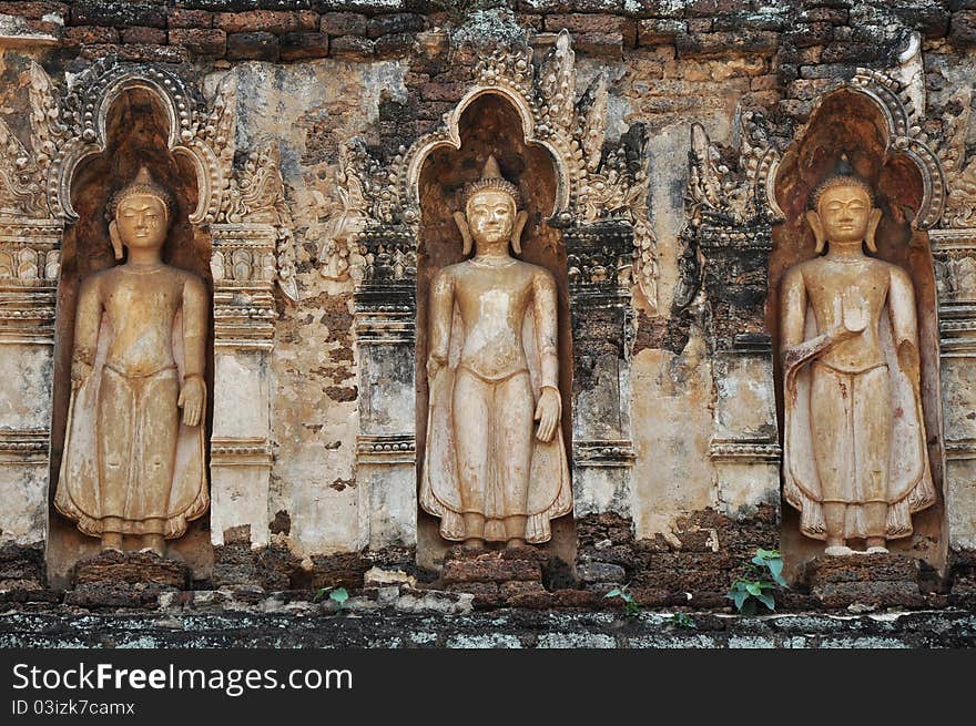 Standing Buddha on stupa