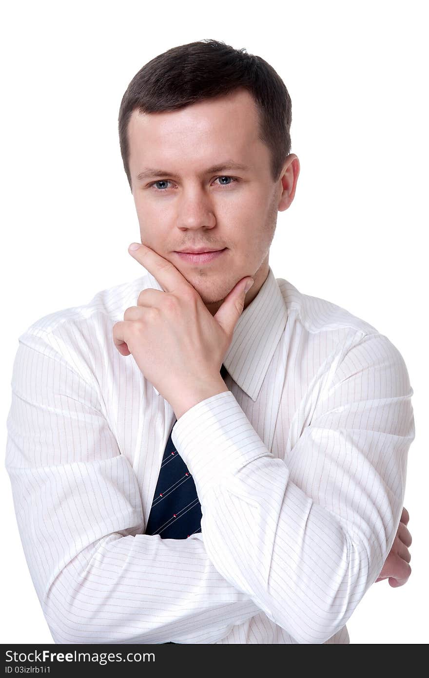 Man in a light shirt, sits with folded hands in front of him. Man in a light shirt, sits with folded hands in front of him