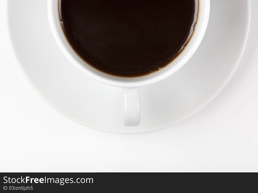 A white coffee cup with brown coffee