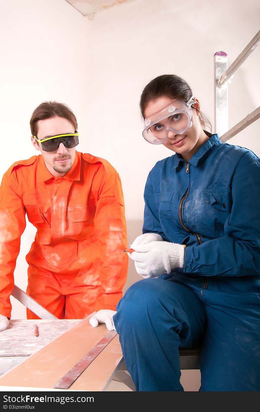 Two construction worker doing measuring