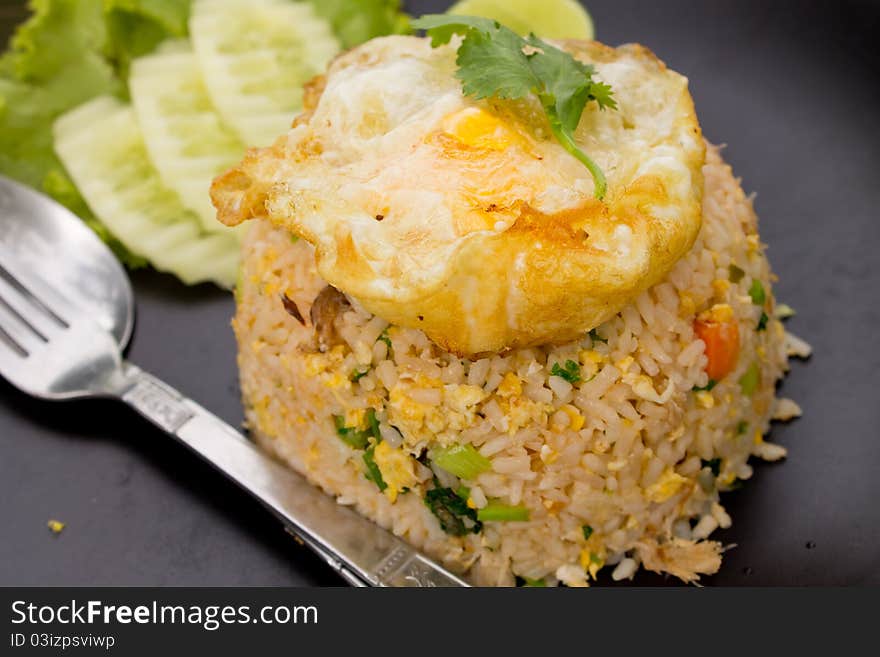 Crab fried rice with fried egg.