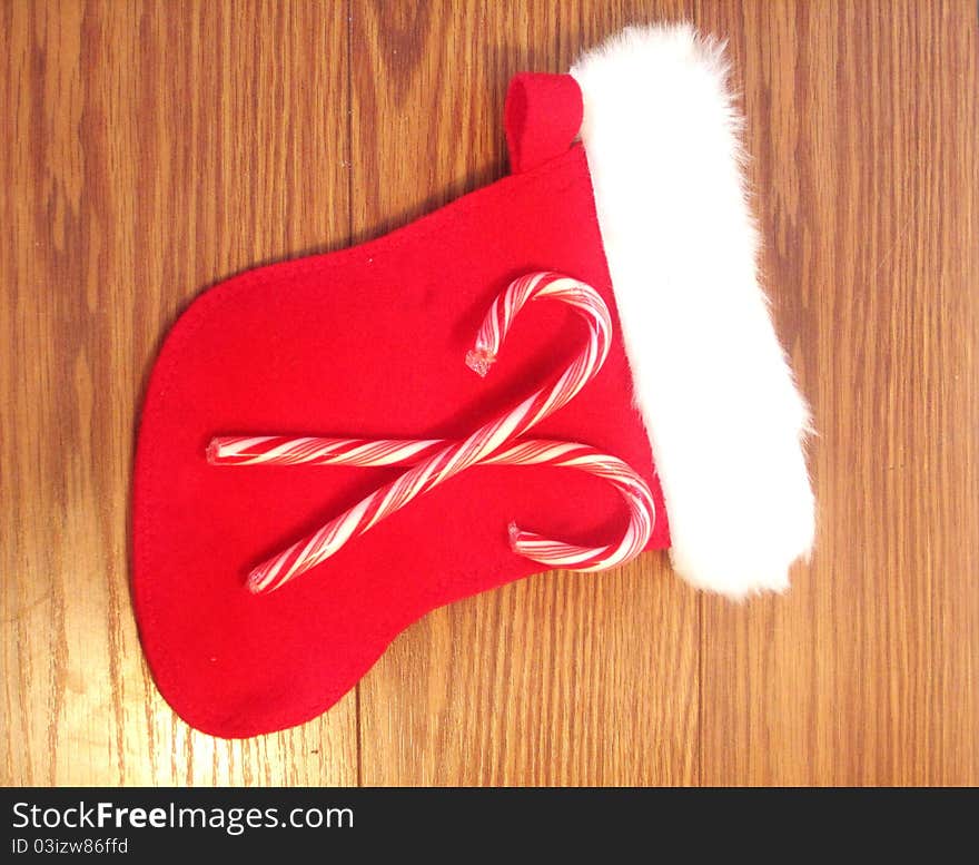 Christmas stocking with two candy canes on top