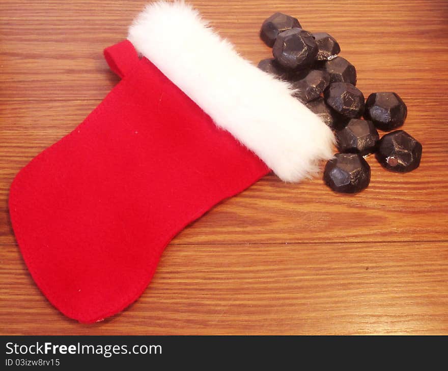 Small childs christmas stocking with coal