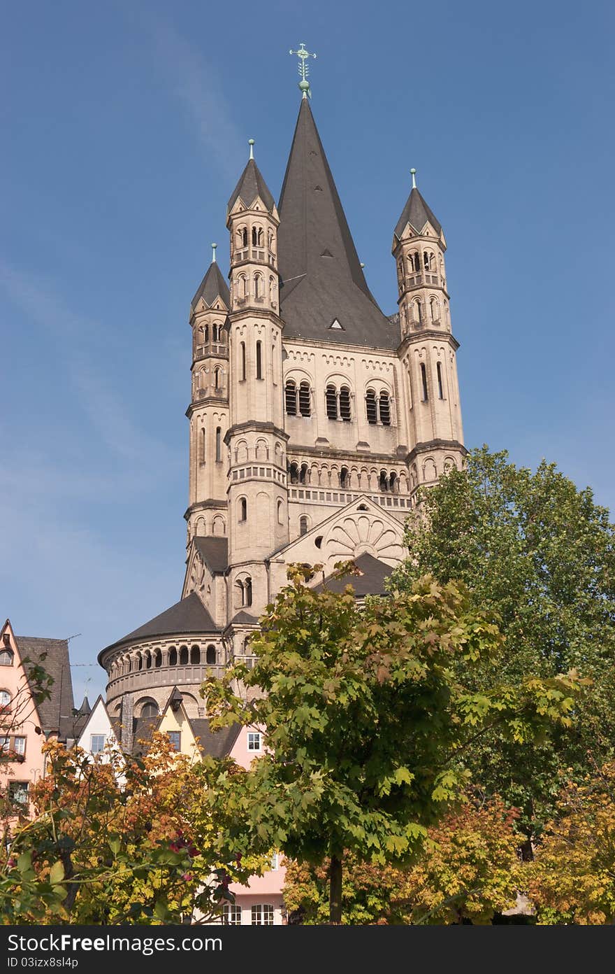 View over Great Saint Martin Church from Fischmarkt in Cologne. This Romanesque church was erected between 1150-1250 and its soaring crossing tower is a landmark of Cologne's Old Town