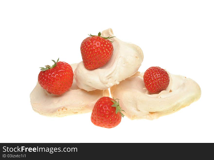 Strawberries and homemade meringues isolated against white. Strawberries and homemade meringues isolated against white