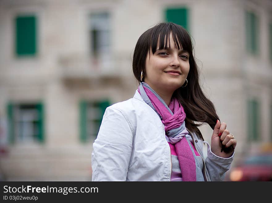 Fashion Model Posing, urban background. Artistic selective focus.