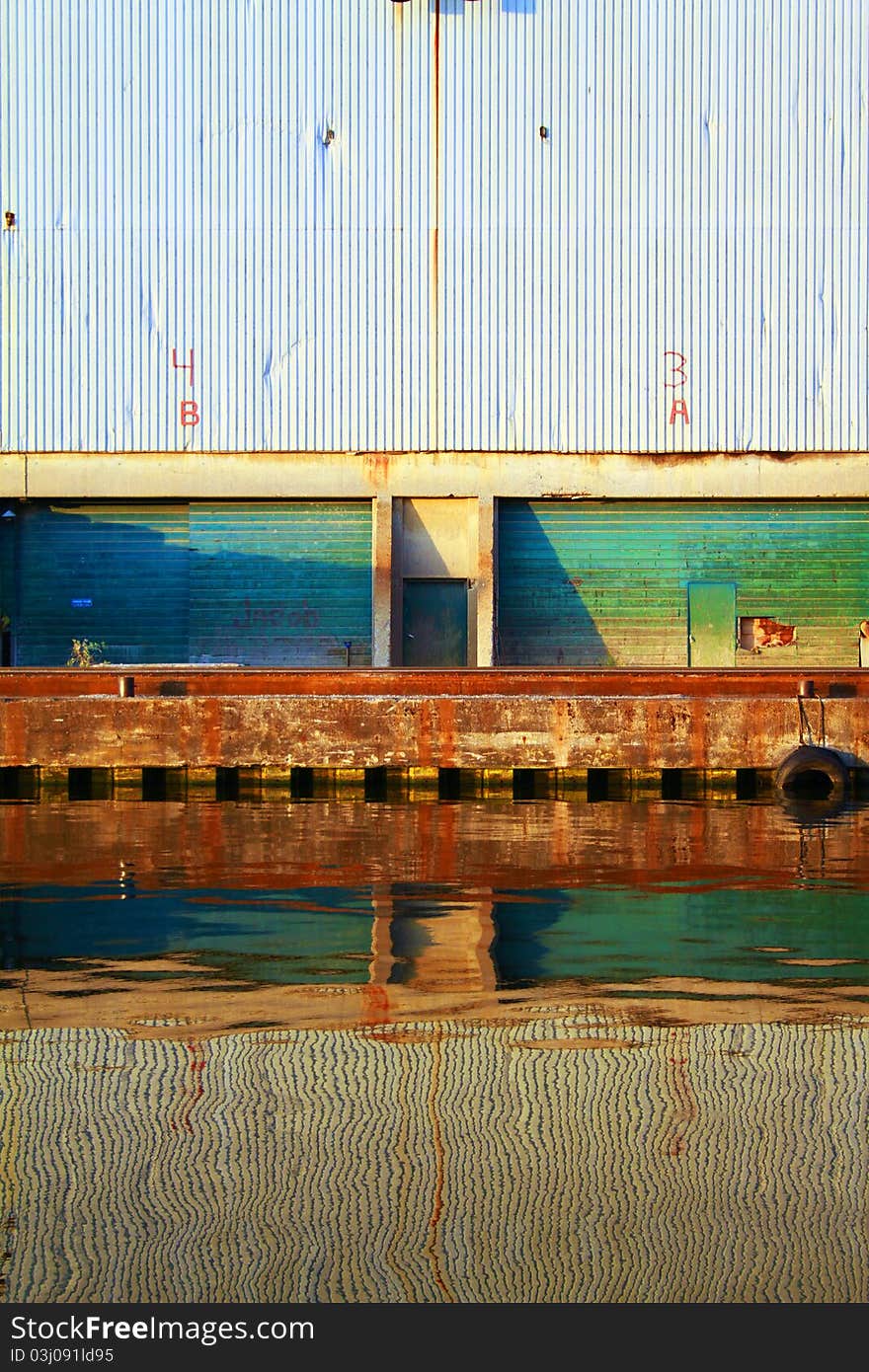 Two gates in green of a old and abandoned factory. Two gates in green of a old and abandoned factory.