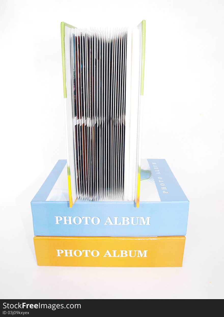 Three photo albums on a white background