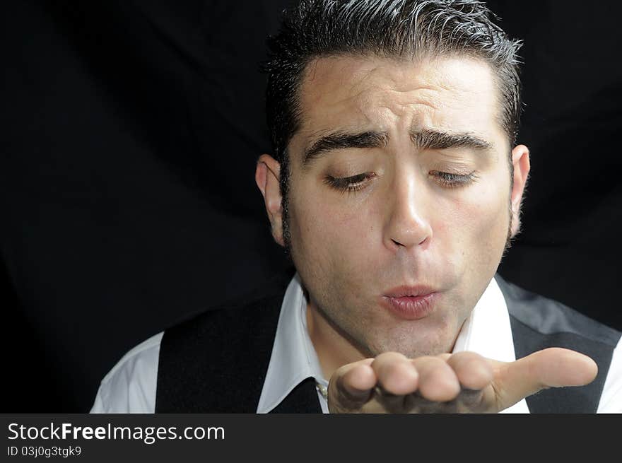 Man Blowing A Kiss