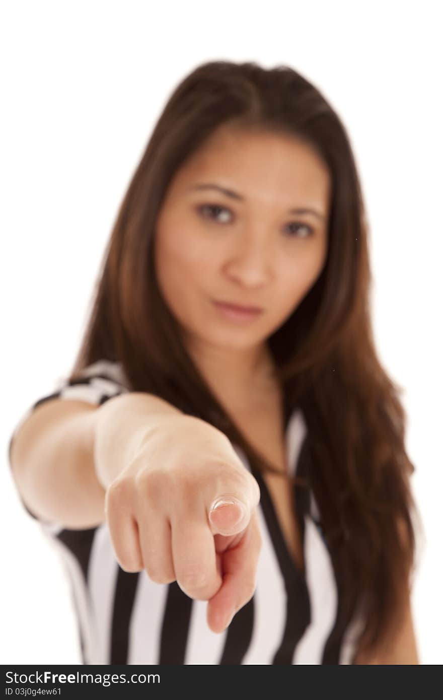 A woman in her referee out fit pointing her finger at the camera. A woman in her referee out fit pointing her finger at the camera.