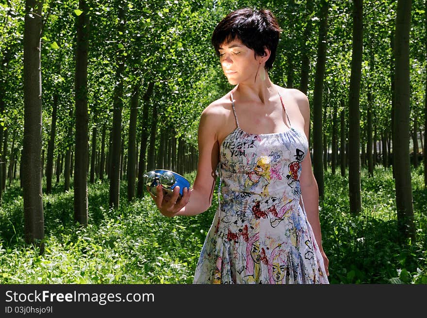 Woman showing the time on a clock. Woman showing the time on a clock