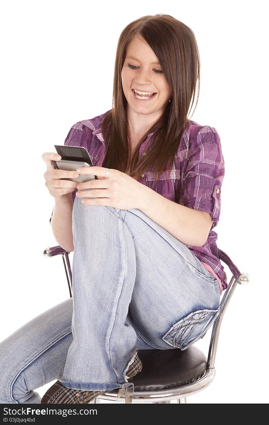 Woman on chair text and smile