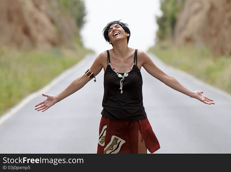 Woman laughing on the road