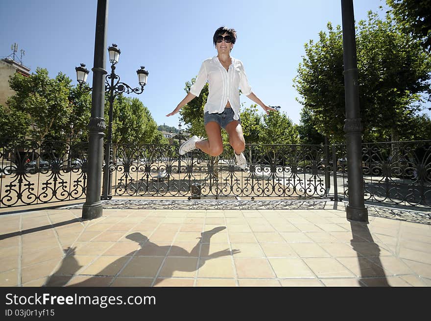 A girl in the park jumping. A girl in the park jumping