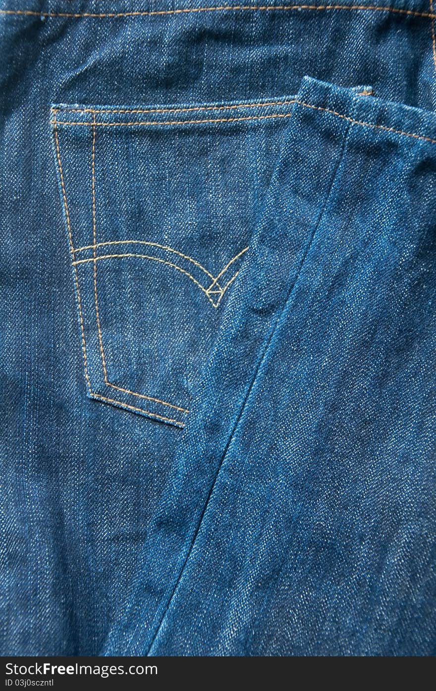 Close-up blue jean pocket to background