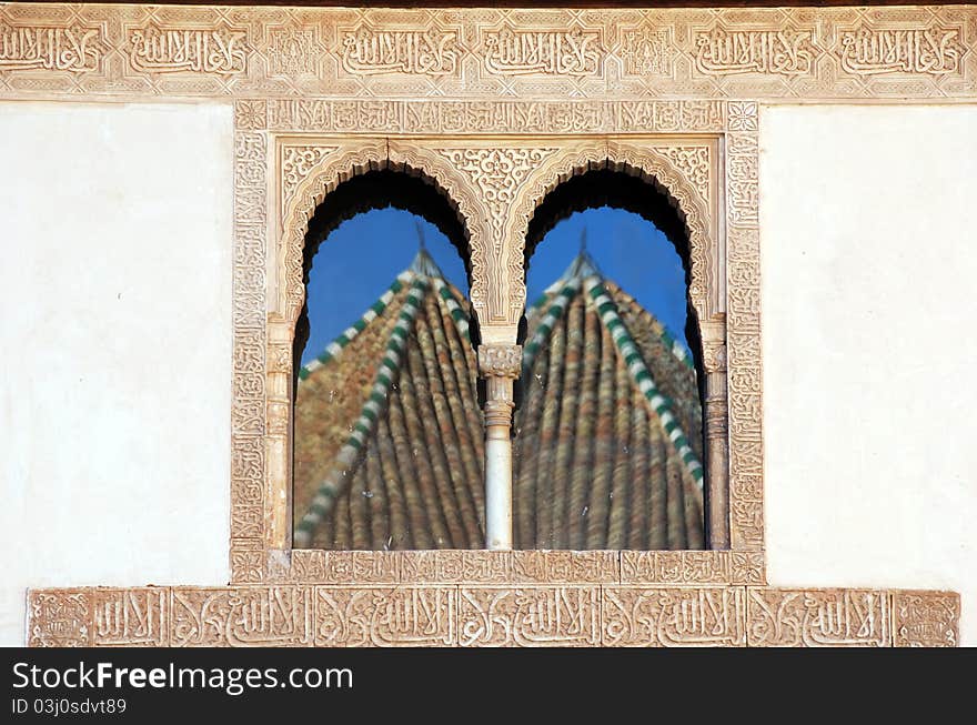 Two domes reflected in a window of the Palace of Comares in the Alhambra, Granada, Andalucia, Spain. Two domes reflected in a window of the Palace of Comares in the Alhambra, Granada, Andalucia, Spain