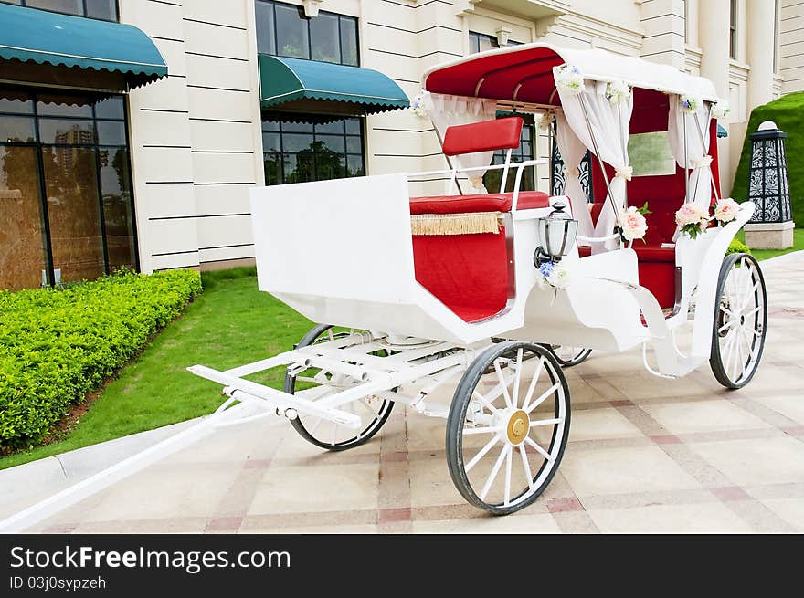 A beautiful  white  Old Horse Carriage