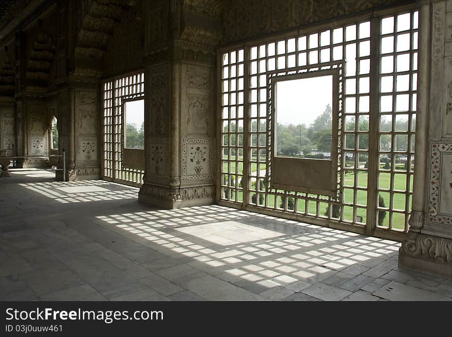 Sunshine pattern of stone window grill at Red Fort, New Delhi, India, Asia. Sunshine pattern of stone window grill at Red Fort, New Delhi, India, Asia