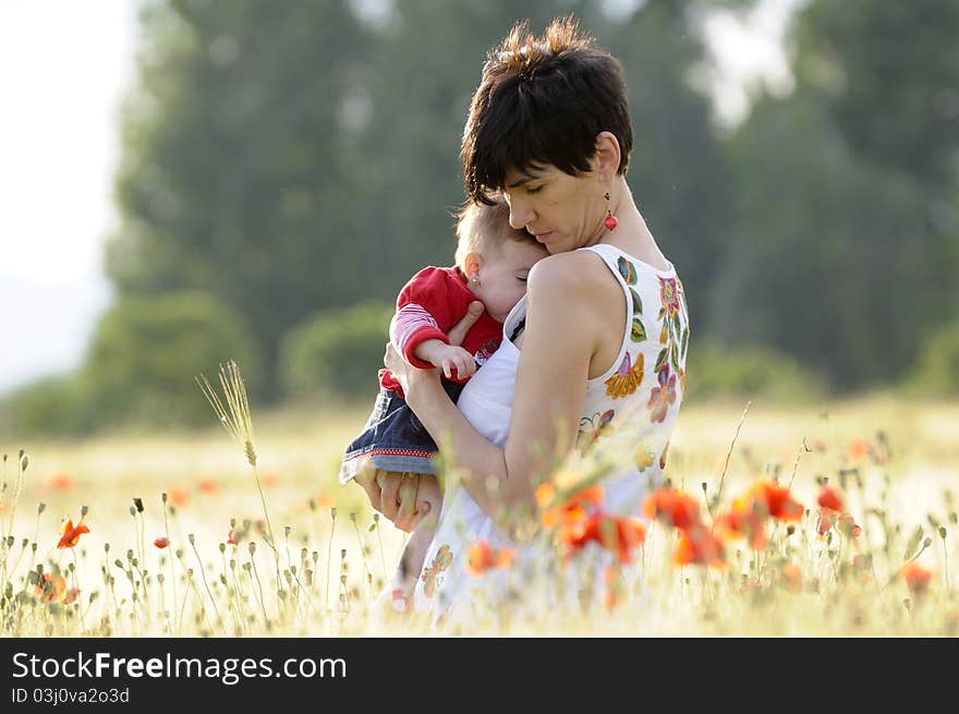 Mother And Daughter In A Poppy Field