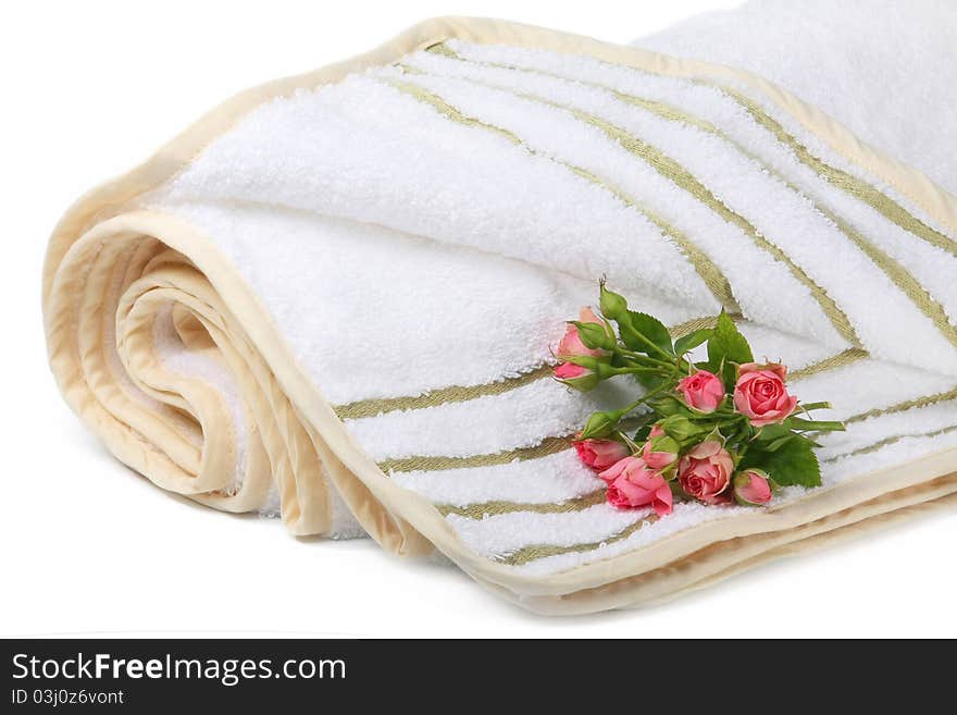 Terry towel with a small bouquet of roses isolated on white background