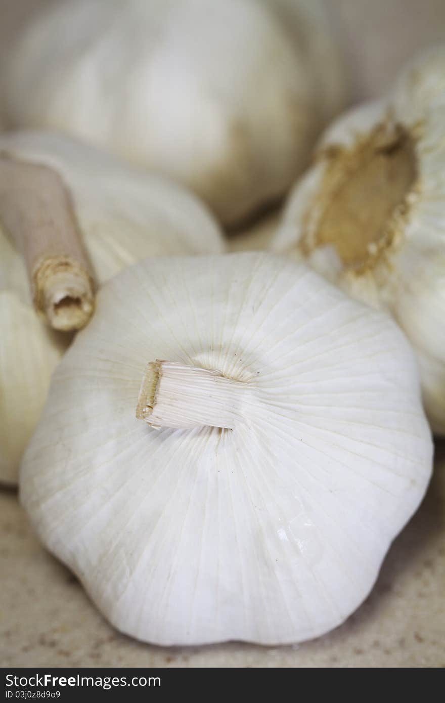 A close-up image of a bunch of fresh garlic