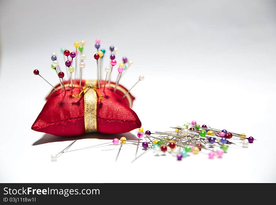 Needle pillow red in isolated white background