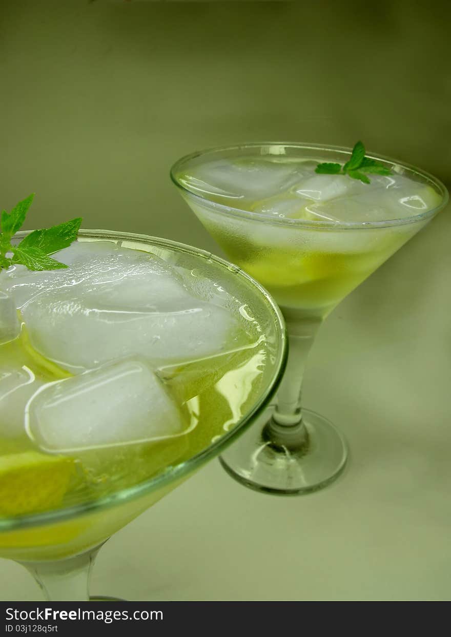 Alcohol yellow liqueur cocktail with ice and lemon. Alcohol yellow liqueur cocktail with ice and lemon