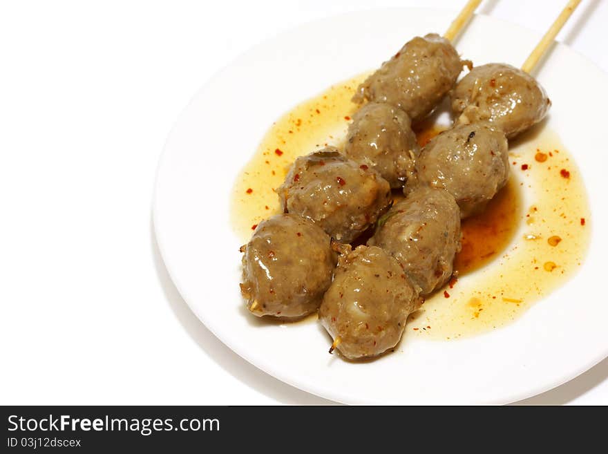 Meatball and sauce on white background