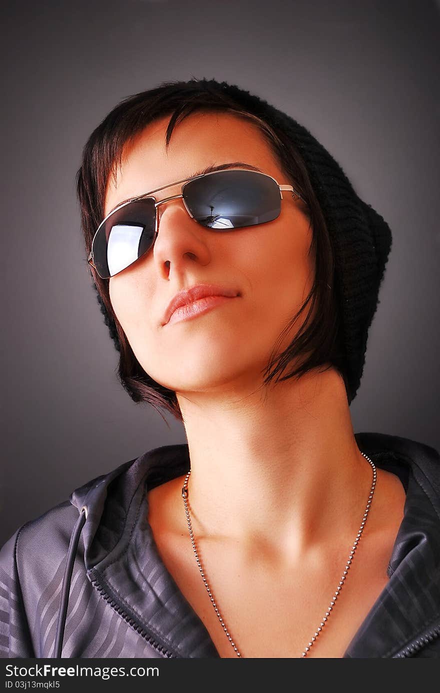 Portrait of a young girl on dark background