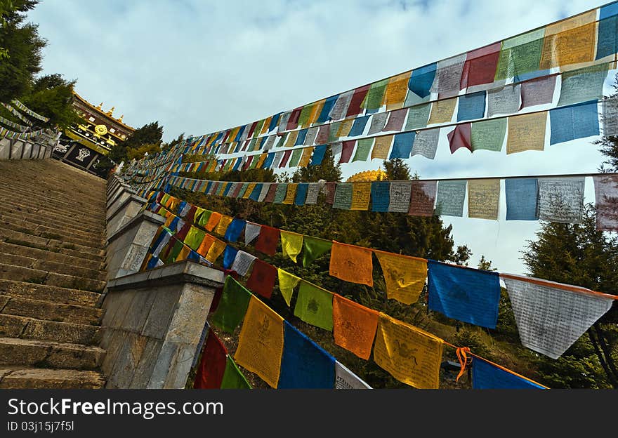 Prayer flags and songzanlin temple,shangri-la china. Prayer flags and songzanlin temple,shangri-la china.