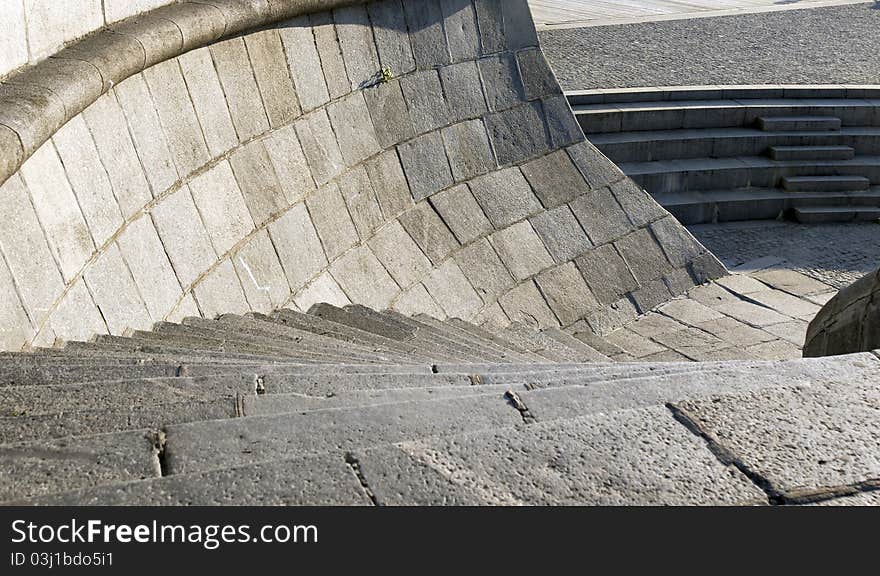 Granite curve modern stairs with stone handrail on a wharf. Granite curve modern stairs with stone handrail on a wharf