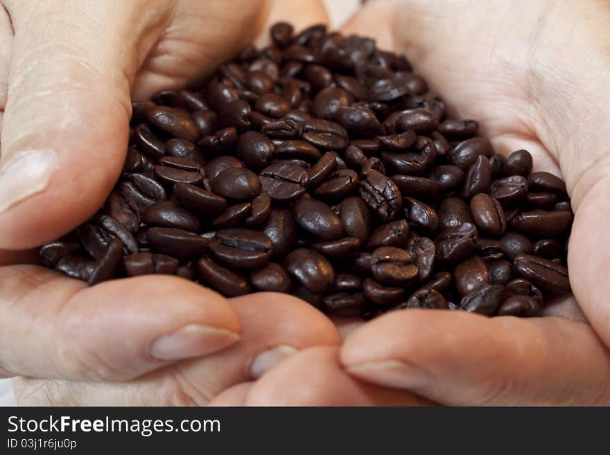 Coffee beans in hands