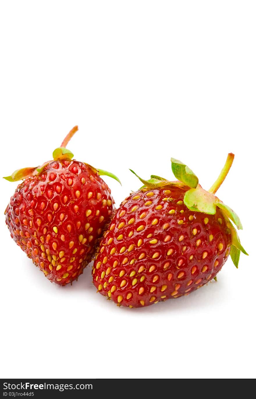 Two strawberries on a white background isolated. Two strawberries on a white background isolated