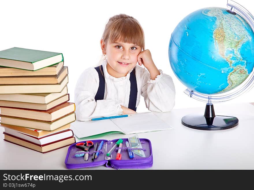 Girl is doing homework. Isolated on white background