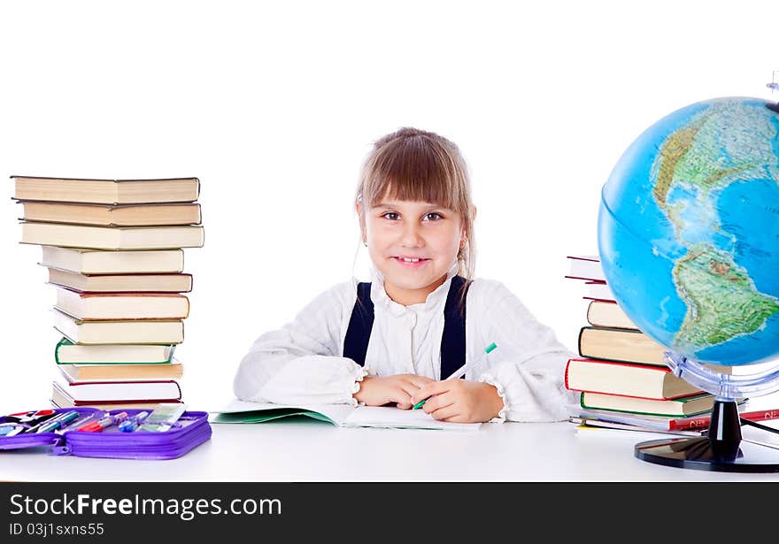 Girl is doing homework. Isolated on white background