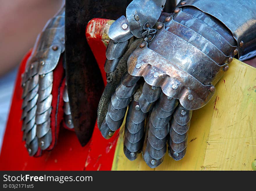 Knight metal gloves, ax and defensive shield. Knight metal gloves, ax and defensive shield