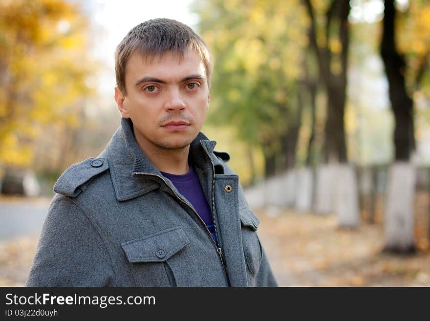 Portrait of a young man with a keen eye on the street