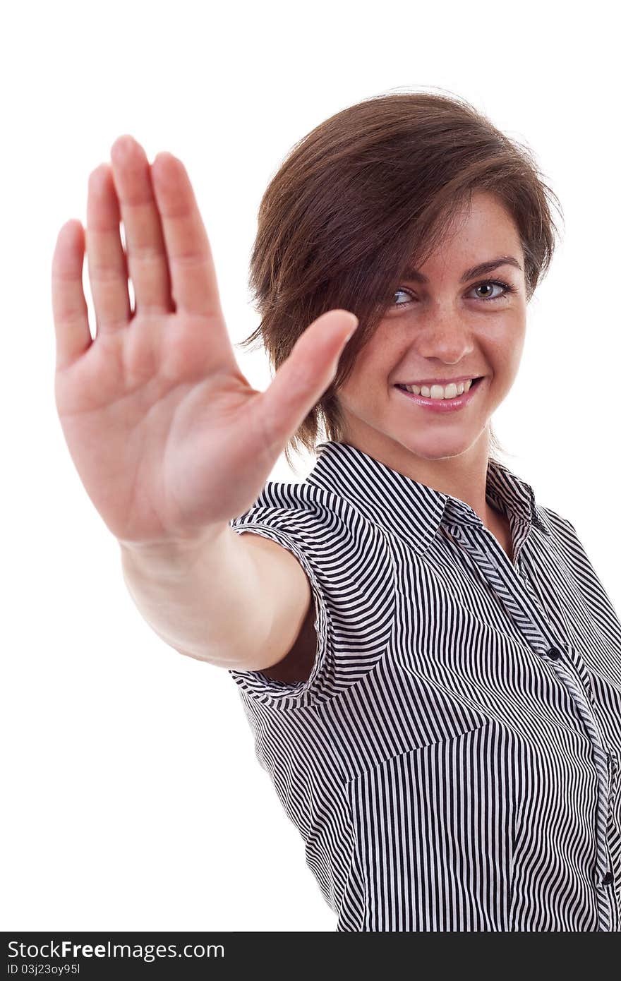 Smiling business woman making stop sign over white,