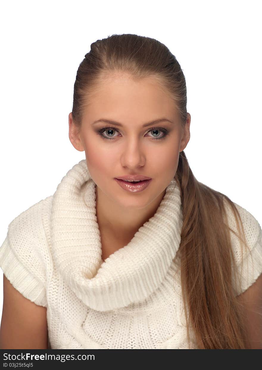 Portrait of a young woman in a light sweater on the isolated background