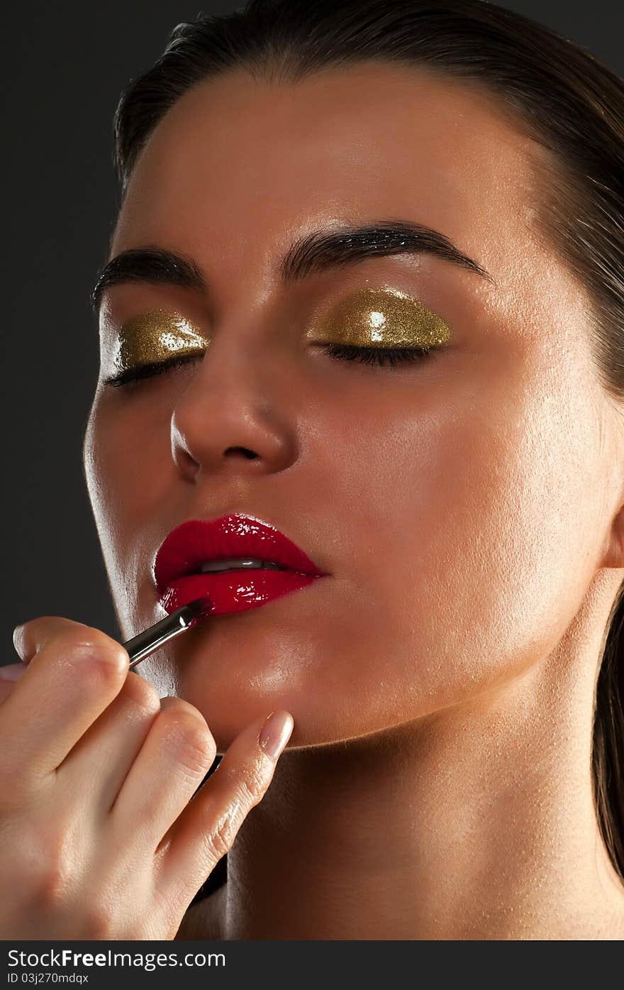 Close-up portrait of beautiful brunette with glamor make-up