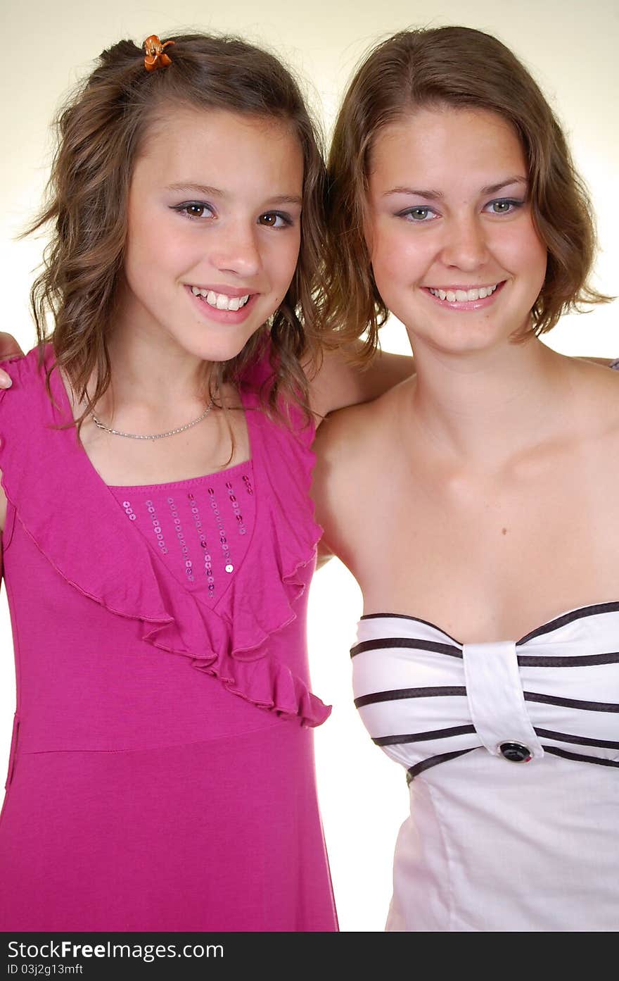 Two beautiful young women in purple and white dress. Two beautiful young women in purple and white dress