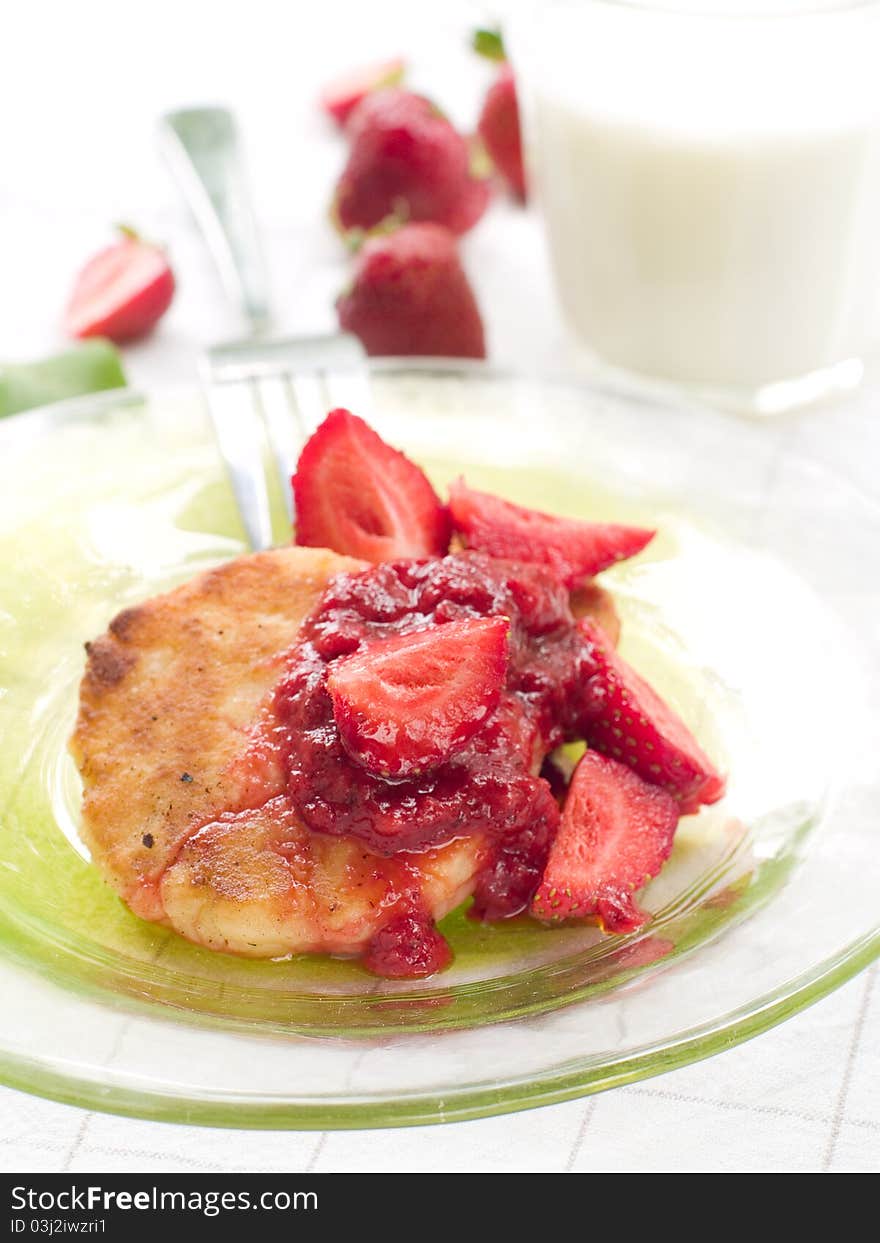 Pancakes with strawberries jam and fresh strawberry